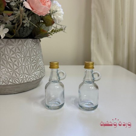 علب زجاج فاضية غطاء دهبي لف